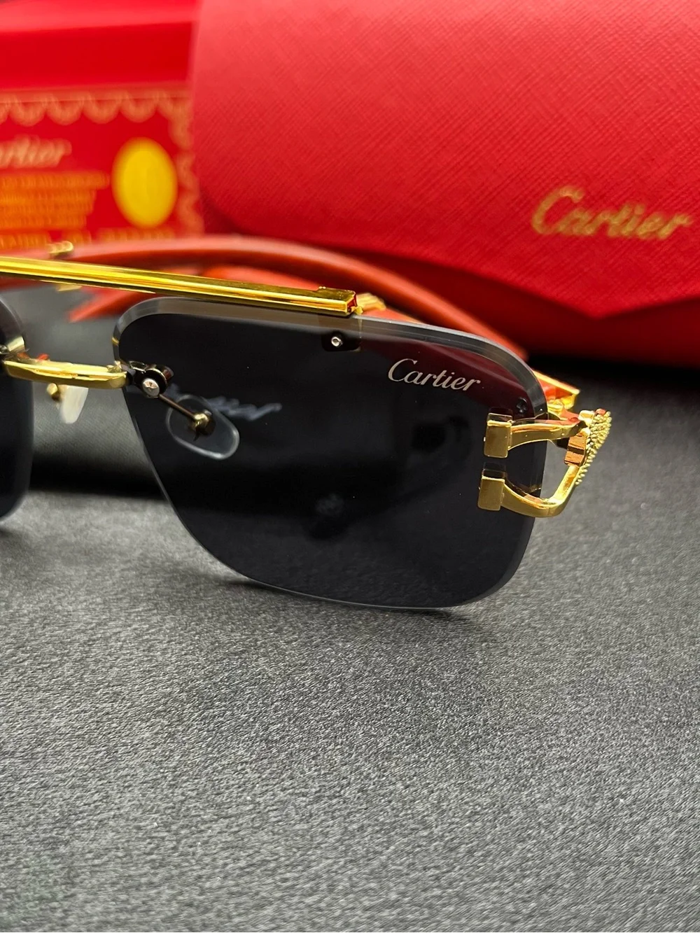 Cartier Men’s Black and Gold Rimless Sunglasses